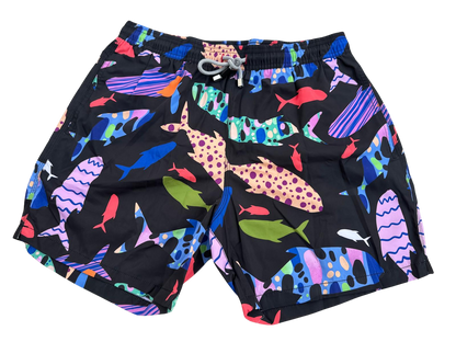 MEN'S FISH PATTERN SWIM SHORTS ON A BLACK BACKGROUND