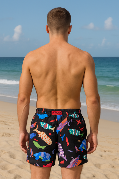 MEN'S FISH PATTERN SWIM SHORTS ON A BLACK BACKGROUND